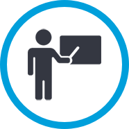 Teacher pointing at a blackboard